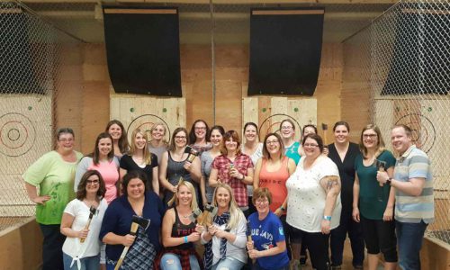 school staff at axe throwing