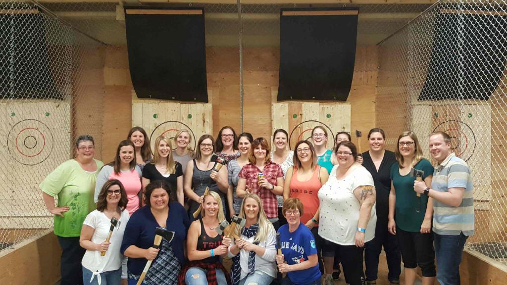 school staff at axe throwing