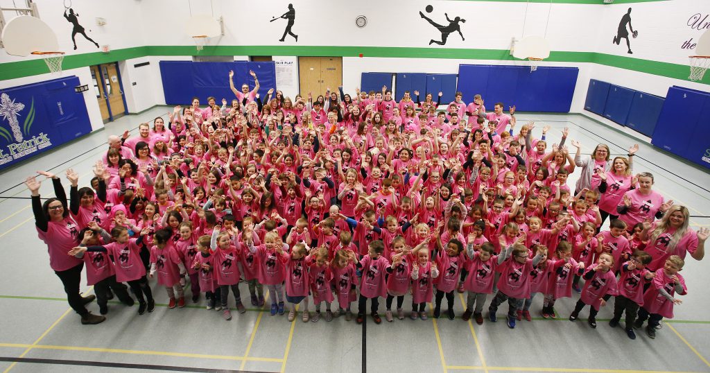 student wearing pink shirts