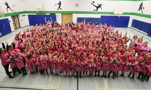 student wearing pink shirts