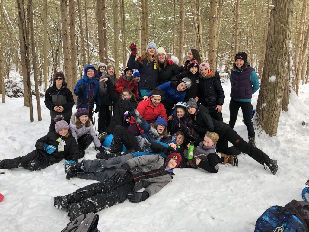 A picture of education award winner Anne Corkery with her classroom in the outdoors