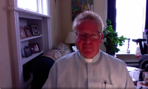 A Screen Grab of Board Chaplain Fr. Paul Massel