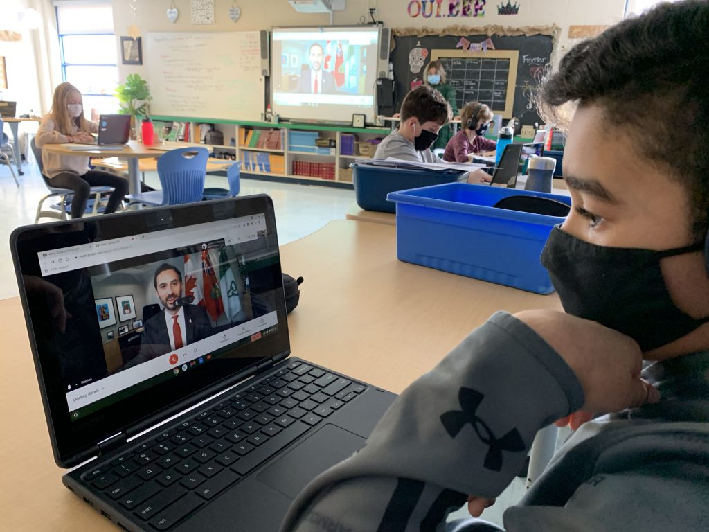 Students view a computer screen