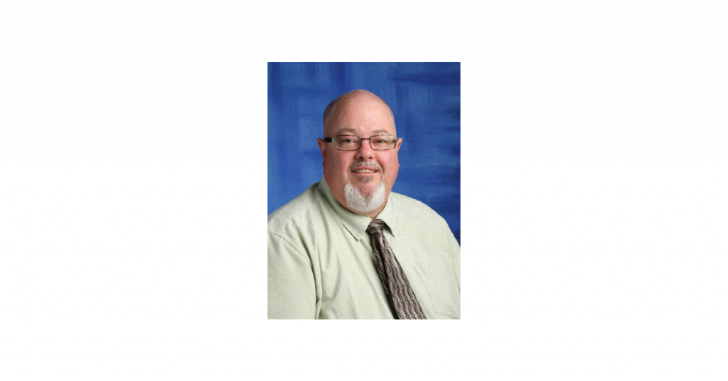 Staff photograph of principal Gerard van den Wildenberg