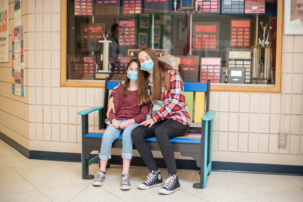 Photo of Shea and Aishling on bench dedicated to Cormack.