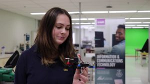 student looking at drone