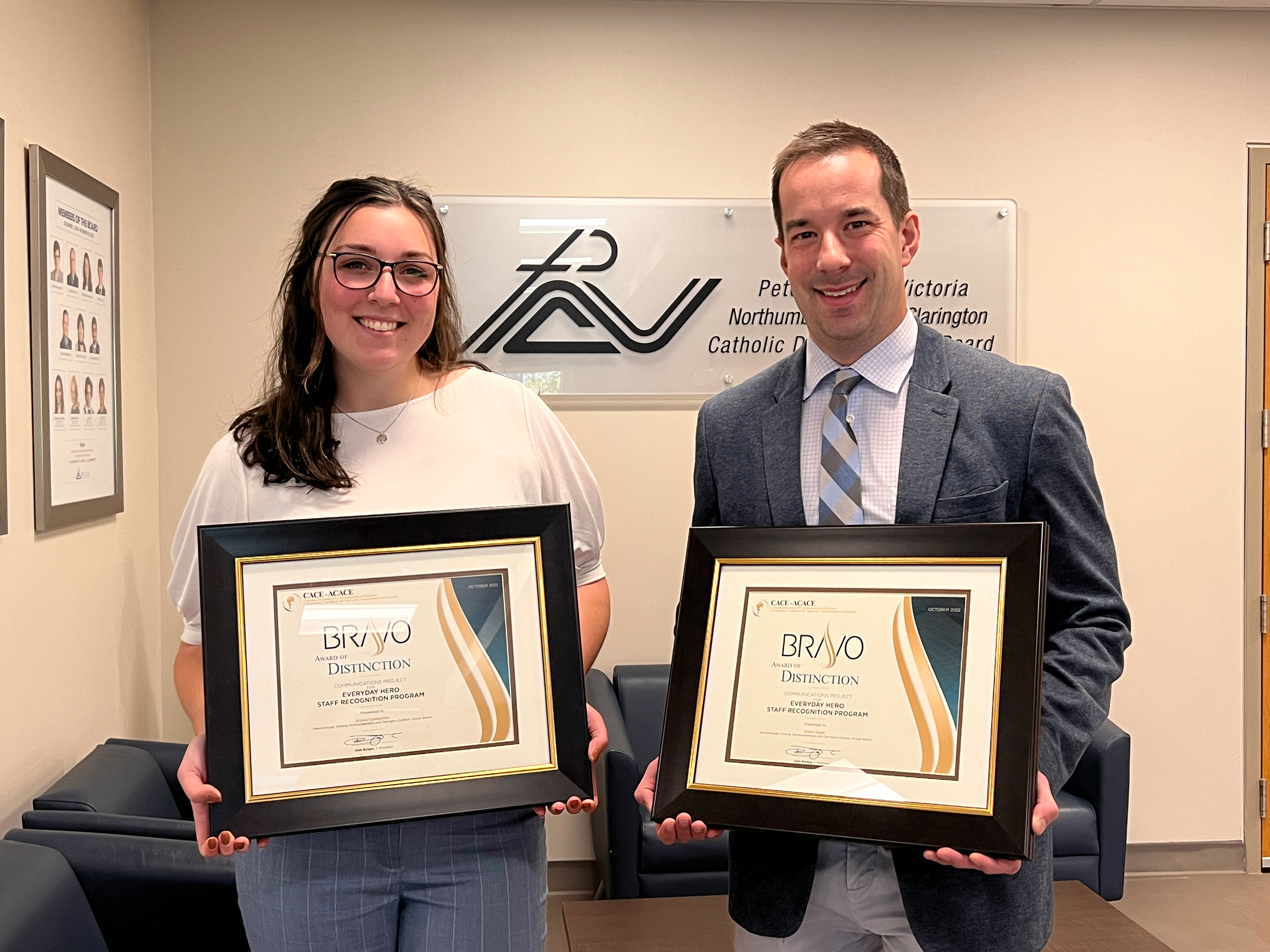 Photo of Communications department holding CACE award certificates.