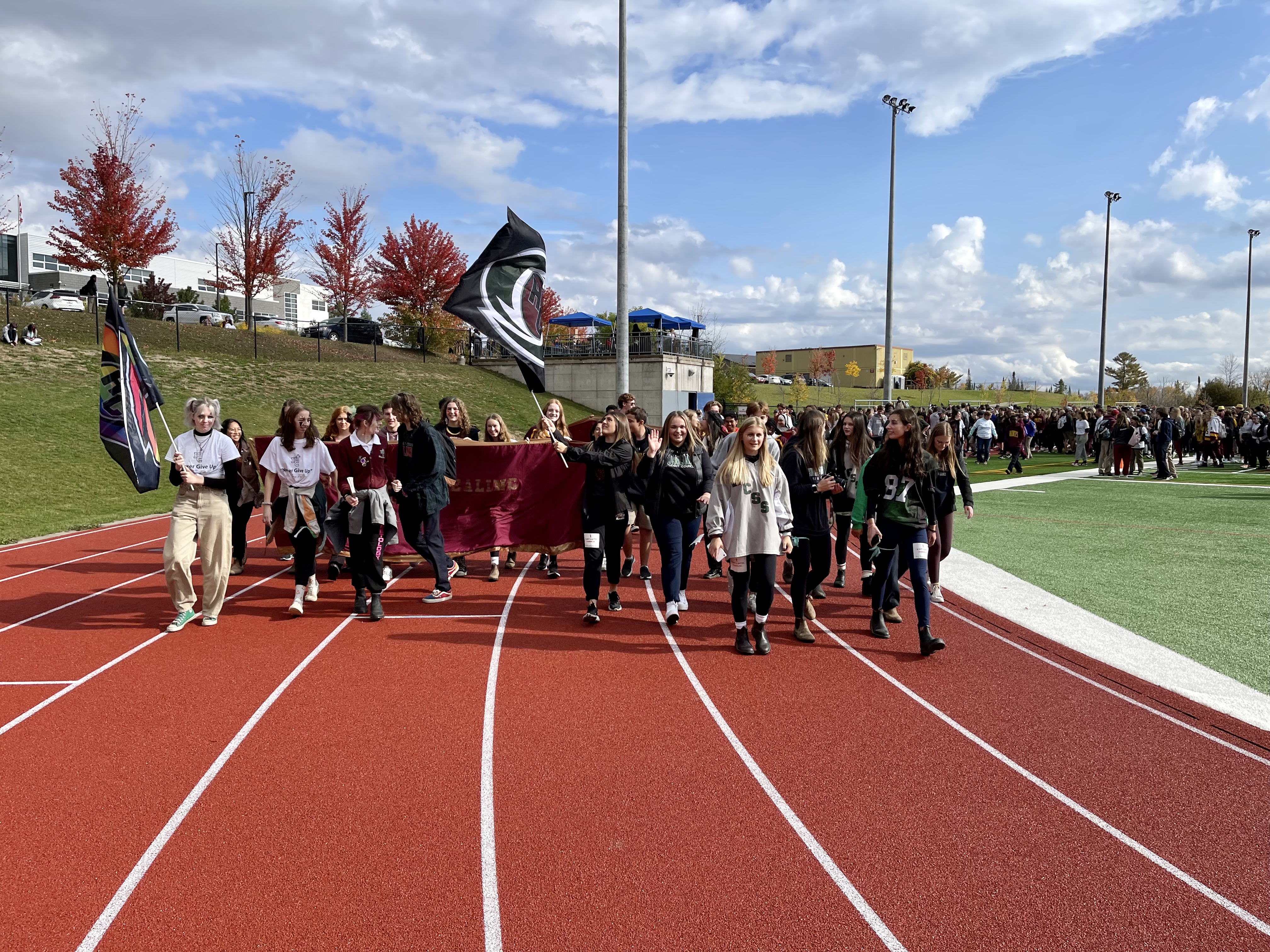 Students walk around a track