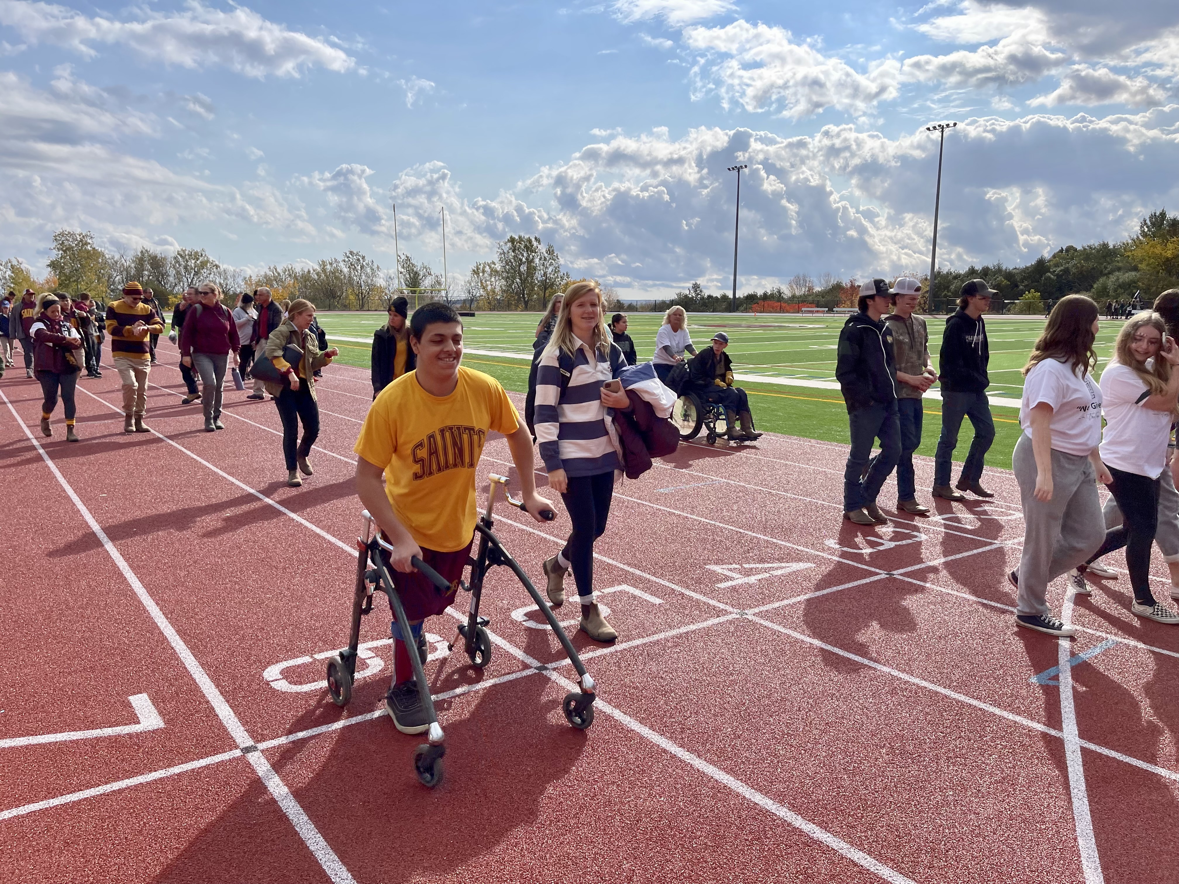 Students walk around a track