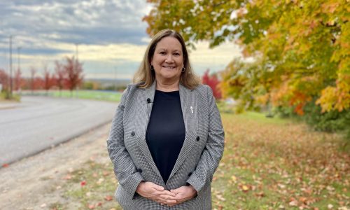 Profile of Director of Education Joan Carragher with autumn background