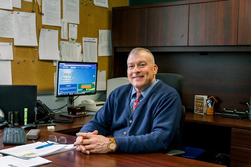 Picture of man sitting at his desk