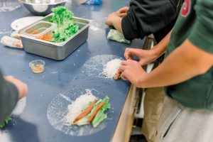 Student making spring rolls