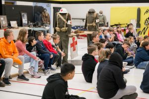 Photo of students at St. Mary Lindsay listening to Jimmy Chapman presentation. 