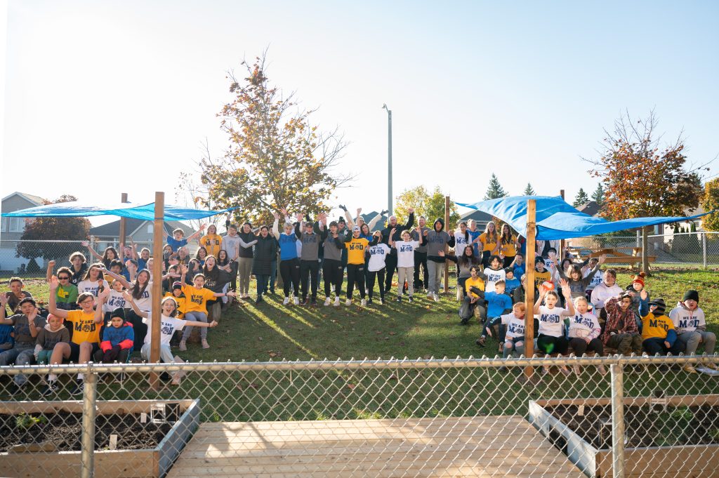 Group photo of student from MOD in new outdoor classroom.