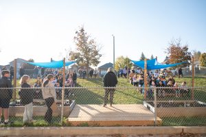 Photo of Jeannie Armstrong speaking in front of students in new outdoor classroom. 