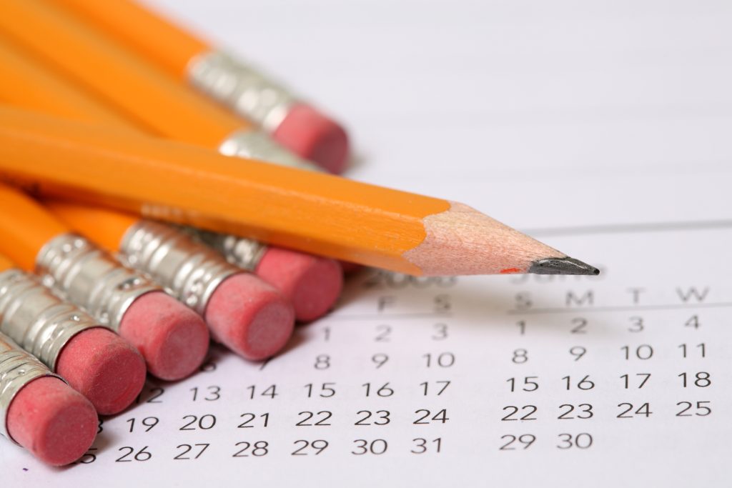 Stock calendar photos featuring pencils on top of a calendar