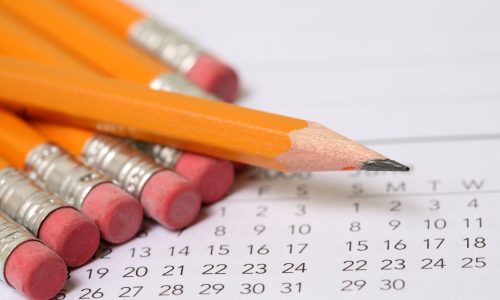 Stock calendar photos featuring pencils on top of a calendar