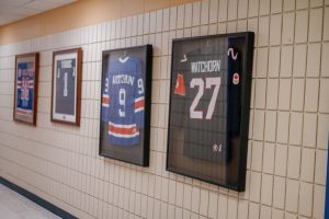 Photo of Tara Watchorn's Team Canada jersey in hallway.