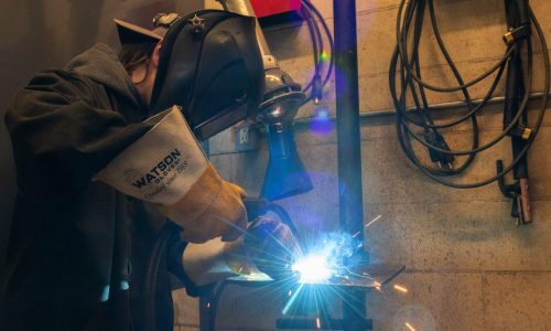 Sparks fly as student CJ Vokes-Greenly works on her project during the Mind Over Matter Welding summer camp with Indigenous youth at St. Peter Secondary School Thursday.