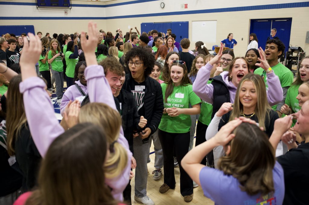 Group of students playing the game Rock, Paper, Scissors