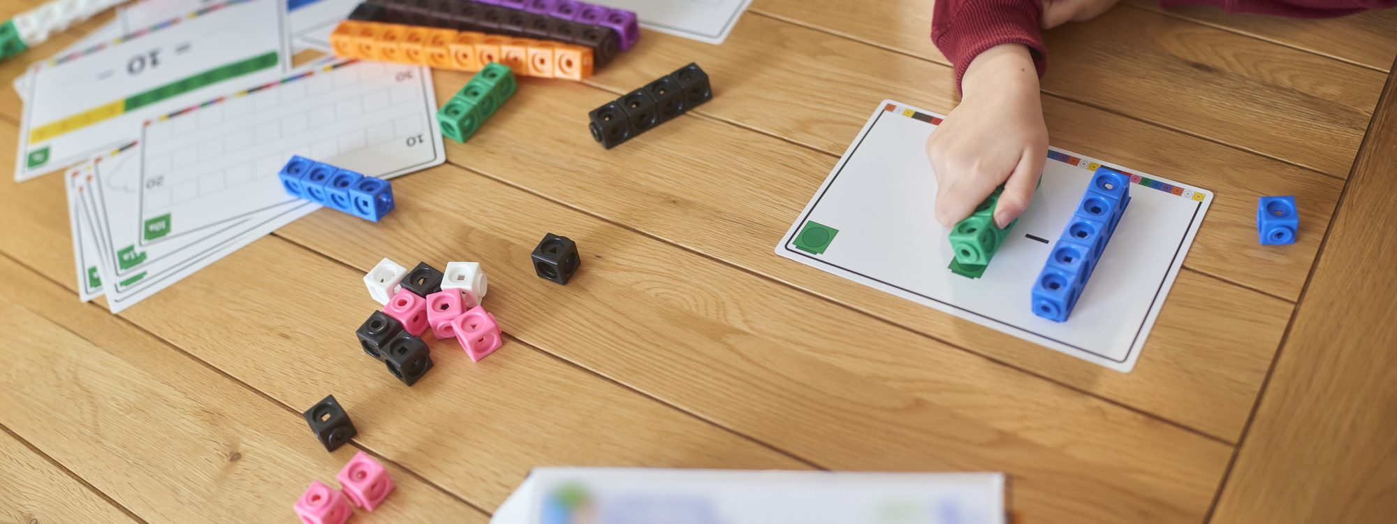 Student using manipulatives to solve a math question