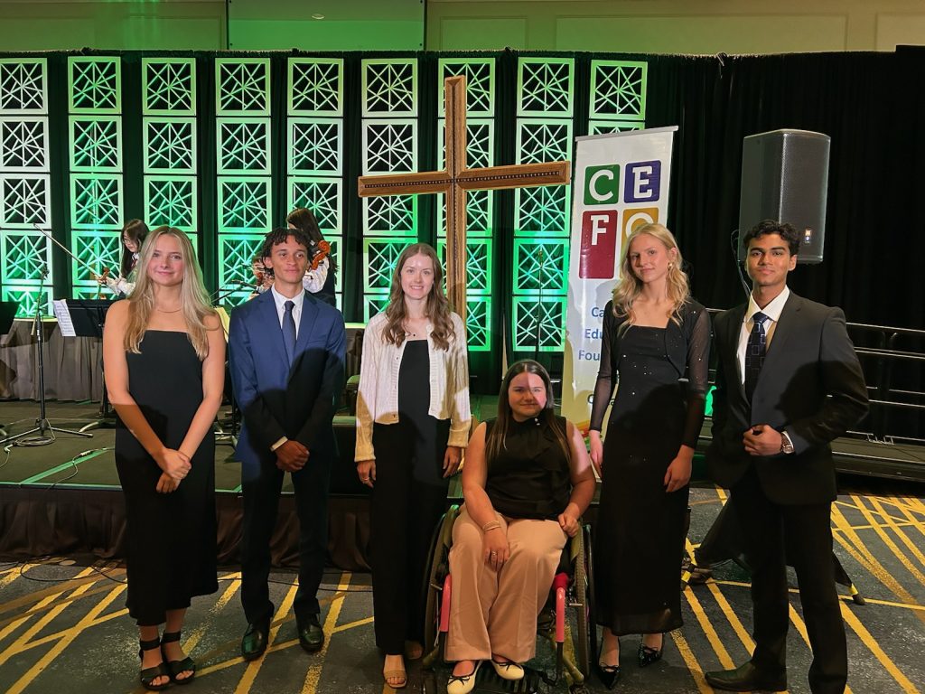 Six students pose together at awards ceremony.