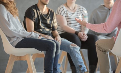 Group of youth sitting in a circle