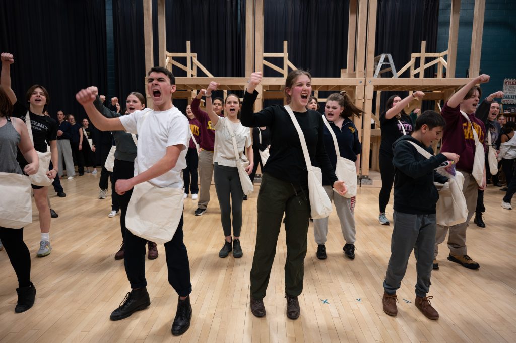Group of students performing in a musical