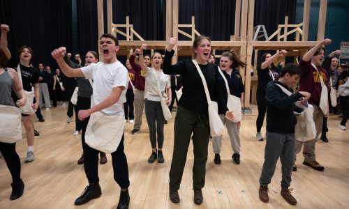 Group of students performing in a musical