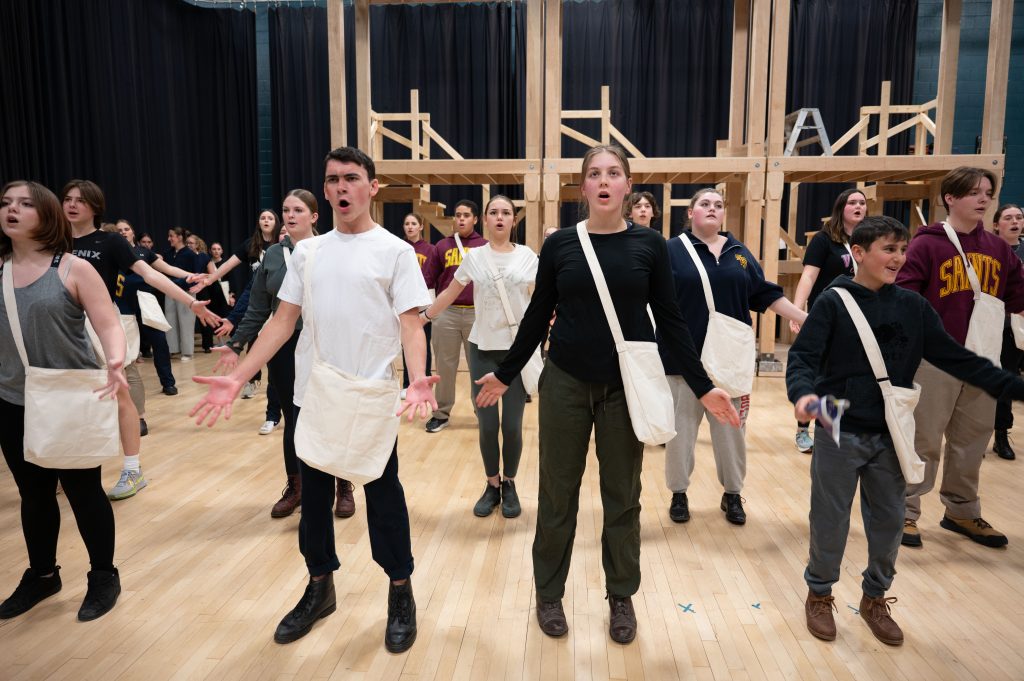 Group of students performing in a musical