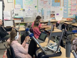 Students wearing pink in classroom for Pink Shirt Day.