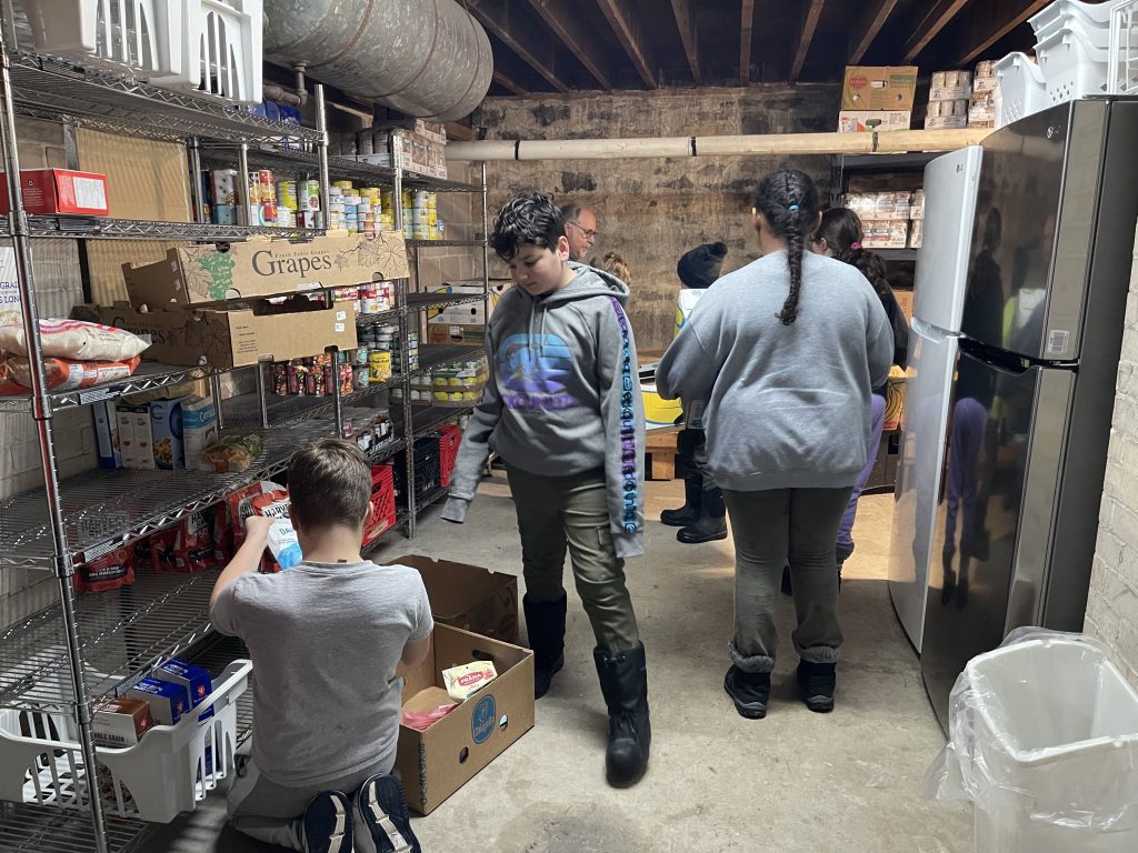 Group of students sorting food at food bank