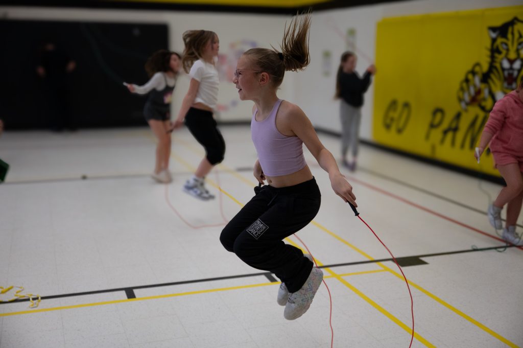 Child jumping rope.