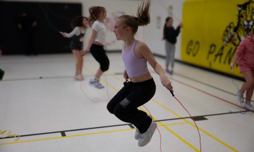 Child jumping rope.