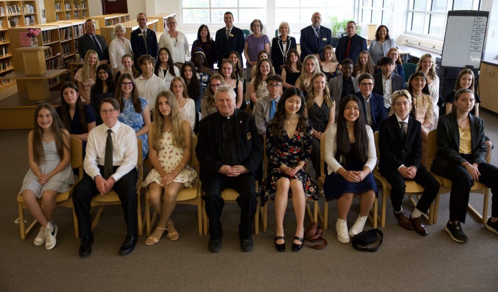 Group photo of students and adults.