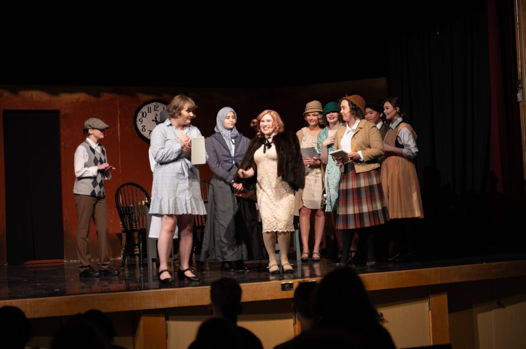 A group of students act in a school play.