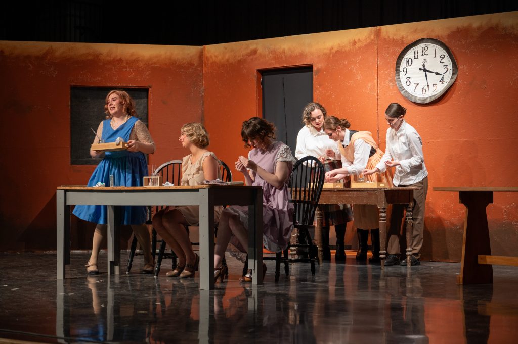 A group of six students act in a play.