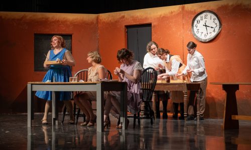 A group of six students act in a play.