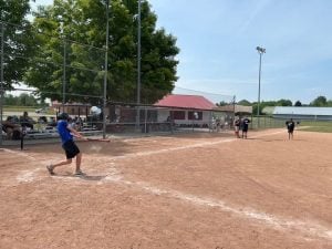 Child hits a baseball during a game.