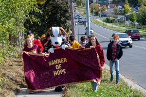 Students carry a banner as they take part in the annual Terry Fox event.