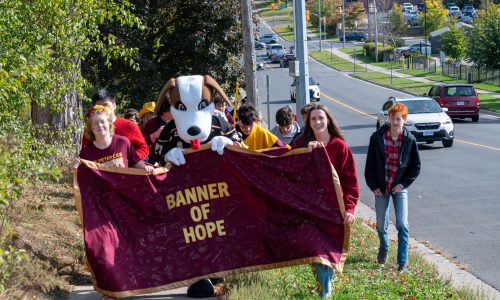 Students carry a banner as they take part in the annual Terry Fox event.