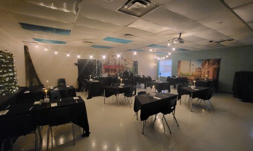 A classroom is transformed into a Parisian cafe complete with decor, lights and music