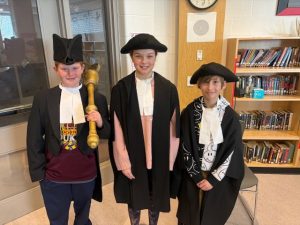 Students dressed as officials with the Ontairo Legislative Assembly.