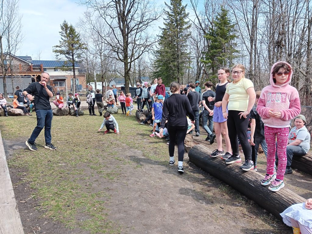 Students take part in Indigenous Learning in an outdoor classroom.