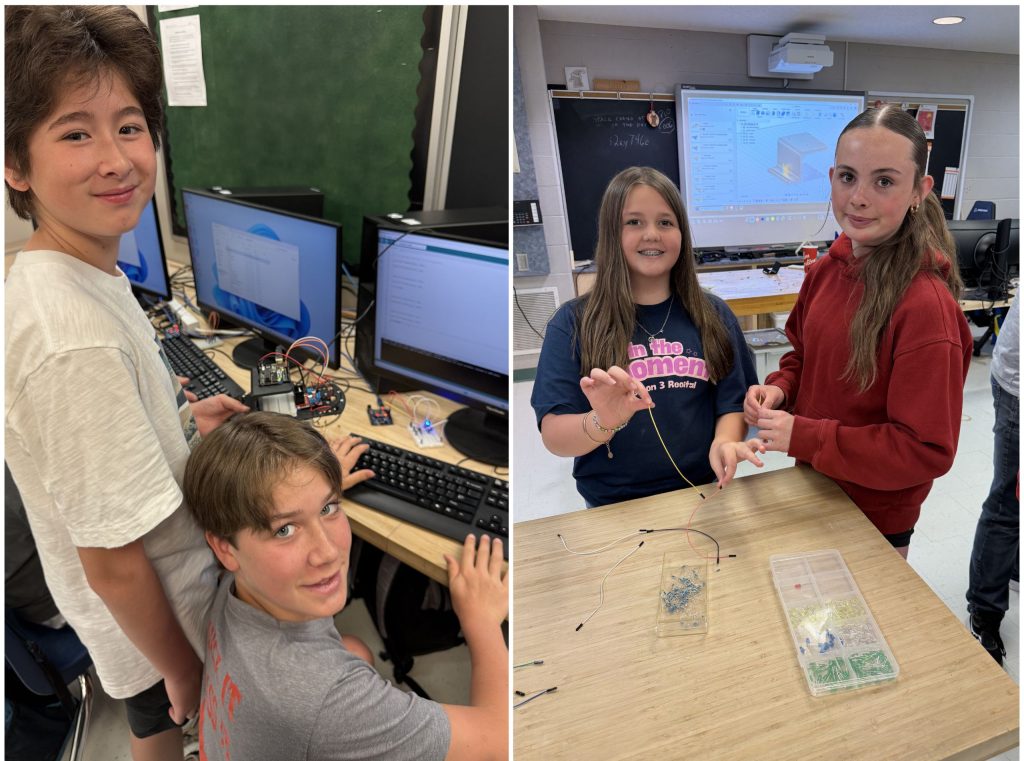 Two male elementary students and two female elementary students try coding in a school lab.