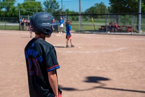 Kids playing baseball.