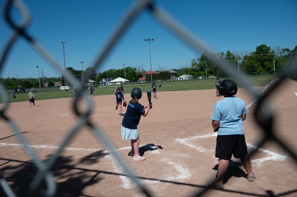 Kids playing baseball.