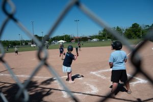 Kids playing baseball.