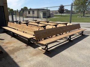 Eight student-constructed benches sit outside.